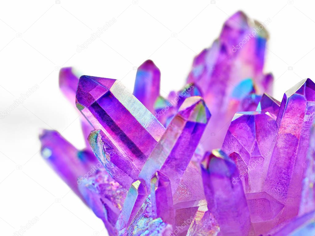 Amazing shiny Purple Quartz Aura crystals cluster with shallow depth of field closeup on white background. Angel aura mineral. Macro of beautiful rare mineral stone