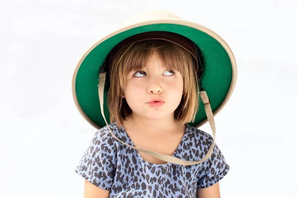 An  preschooler,kid girl in a safari hat and explorer clothes Imitating animal — Stock Photo, Image