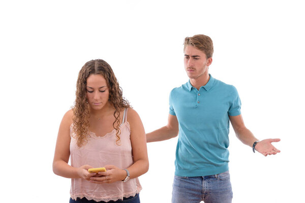 angry couple because they have read or seen some infidelities on their partner's mobile phone isolated in white background