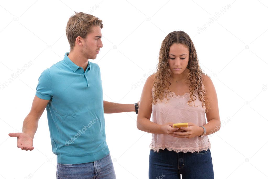 angry couple because they are hooked to the mobile phone all day isolated in white background