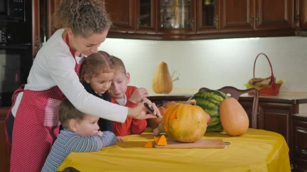 Mother Children Preparing Halloween Pumpkins Kitchen Table Video — Stock Video