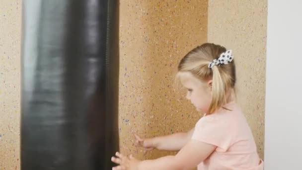 Adorable Little Girl Ponytails Making Physical Exercises Punching Bag Happy — Stock Video