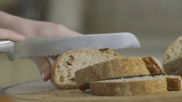 Woman Cuts Bread Pieces Cutting Board Kitchen Close — Stock Video
