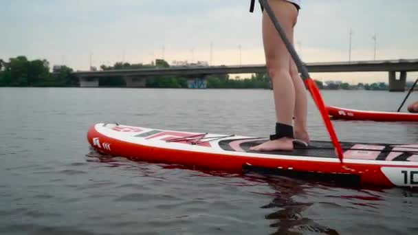 Two Beautiful Girls Rowing Kayak River One Swims Standing Kayak — Stock Video