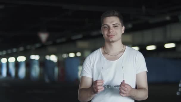 Portrait Happy Man White Shirt Wearing Sunglasses Standing Underground Parking — Stockvideo