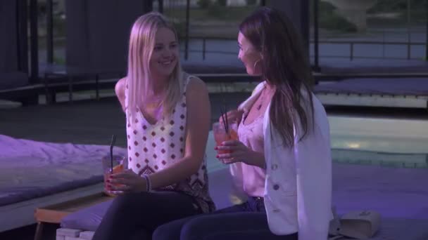 Two Delicious Girls Drink Cocktails While Sitting Nightclub Summer Terrace — Stock Video