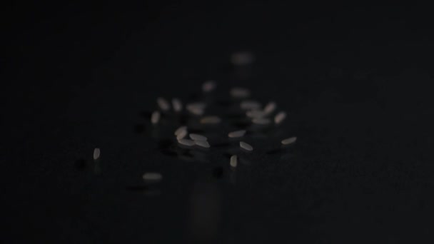 Grain Rice Falls Dark Surface Rice Grain Close Black Background — Stockvideo