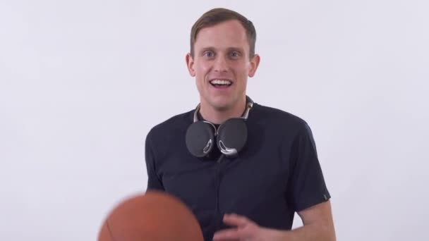 Portrait Young Guy Headphones Juggling Basketball His Hands — 비디오