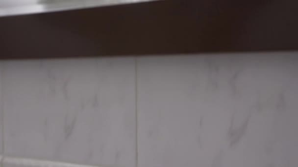 Confident Man White Bathrobe Wipes His Face Towel Looking Mirror — Stockvideo