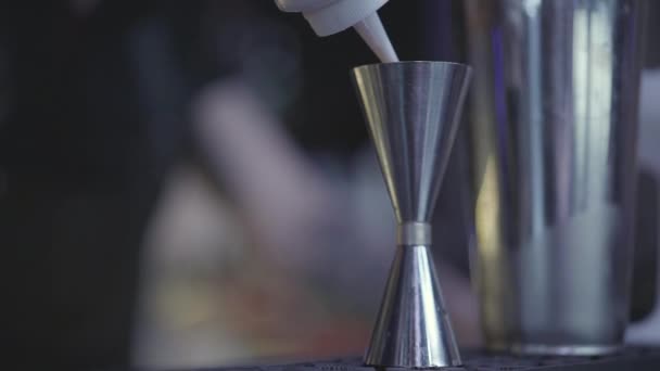 Close Shot Bartender Hand Pouring Drink Bottle Measuring Cup Cocktail — Stock Video