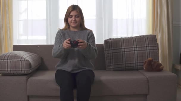 Plump Girl Playing Video Game Sitting Sofa Home Chubby Woman — Stock Video