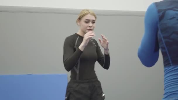 Portrait Female Blond Trainer Teaching Athletic Man How Elbow Punch — Stock Video