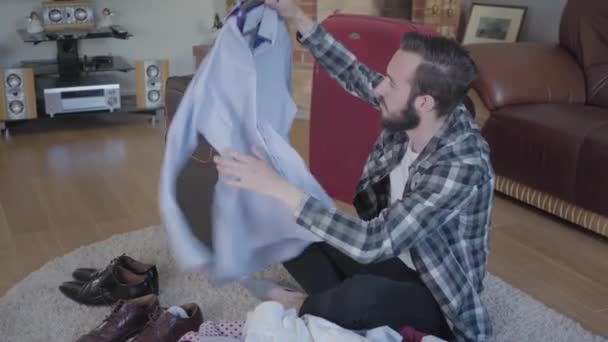 Video Tired Bearded Man Floor Packing Big Suitcases Many Cloth — Wideo stockowe
