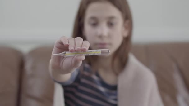 Tired Sick Girl Sitting Sofa Showing Thermometer Camera Video — Stock Video