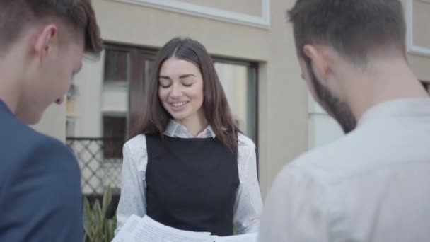 Young Woman Men Formal Wear Discussing Documents Terrace Girl Giving — Stock Video