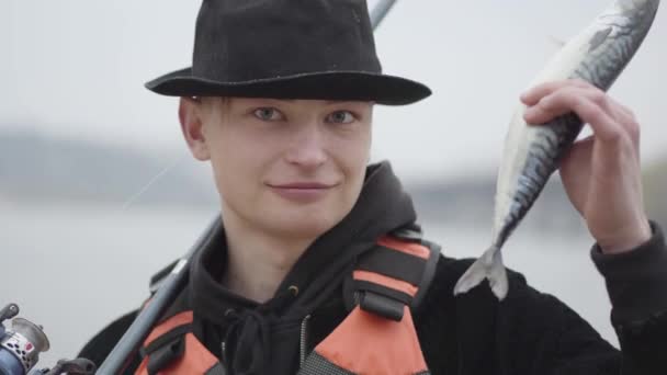 Young Confident Happy Fisherman Wearing Cap Brim Early Morning Catch — Stock Video