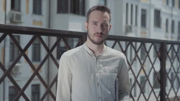 Portrait Pretty Young Man Terrace Looking Camera Holding Laptop Hands — Stock Video