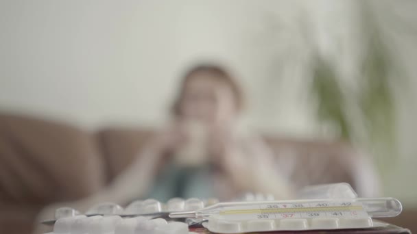 Pills Thermometer Lying Table Close Blurred Figure Young Woman Wrapped — Stock Video