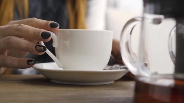 Close Hand Caucasian Woman Black Nails Touching White Tea Cup — Stock Video