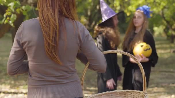 Two Caucasian Teenagers Halloween Costumes Standing Pumpkin Looking Redhead Woman — ストック動画