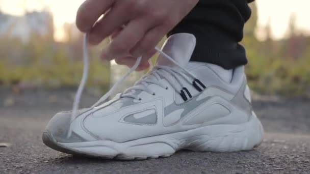 Close Young Caucasian Hands Tying Shoelaces White Sportive Put Sneakers — Stock Video