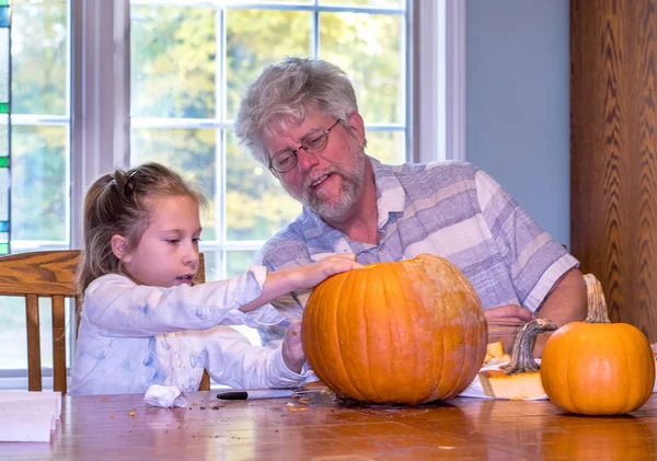 Grandpa Watches Child Draws Face Pumpkin Him Carve — Stock Photo, Image