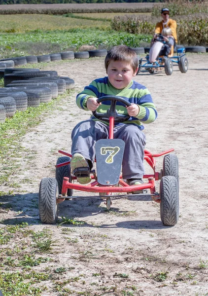 Little Boy Races Others Track Peddle Car — Stock Photo, Image