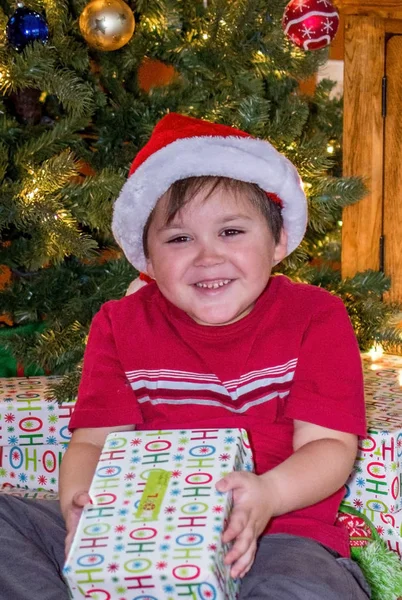 Happy boy with christmas present — Stock Photo, Image