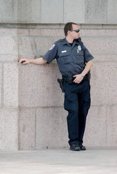 Police man watching and waiting — Stock Photo, Image