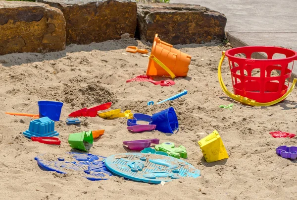 Colorful sand toys in the sand — Stock Photo, Image