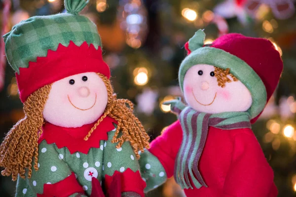 Cute christmas doll couple in red and green — Stock Photo, Image