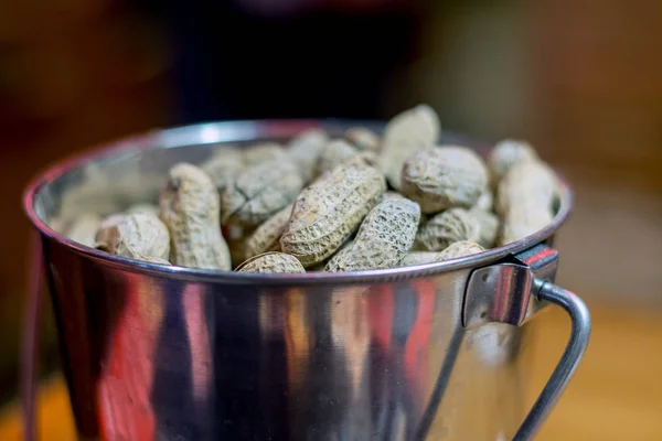 Silver cup of roasted peanuts — Stock Photo, Image