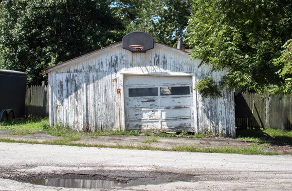 Old wooden garage with a basket ball hoop