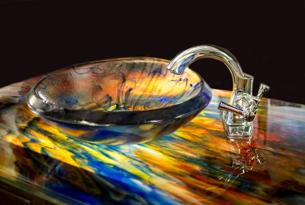 Beautiful stained glass sink on a glass counter top — Stock Photo, Image