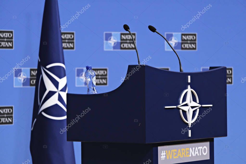 Brussels, Belgium. 25th June 2019. A podium with a sign of NATO during a press conference ahead of the Nato Foreign ministers meeting at NATO headquarters.