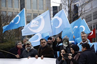 Activists Protest Chinese Treatment Of Uyghur Muslims in Brussel clipart