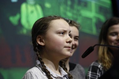 Swedish environmental activist Greta Thunberg attends a conferen clipart