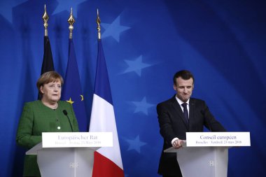 Brüksel, Belçika. 23 Mart 2018. Almanya Başbakanı Angela Merkel ve Fransa Cumhurbaşkanı Emmanuel Macron, Avrupa Birliği (Ab) liderlerinin zirvesinin ikinci gününde basın toplantısı düzenledi. 