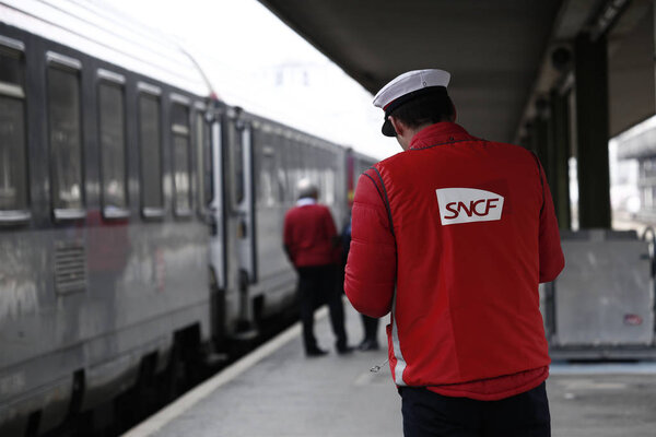 Paris,France Mar. 22,2018. Railway worker stands in platform on Gare de Bercy railway station during a nationwide strike by French SNCF railway workers