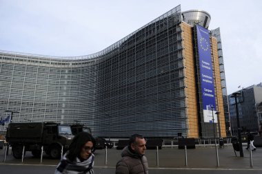 Pedestrians walk outside of the European Commission's Berlaymont building in Brussels, Belgium on Oct. 31, 2018 clipart