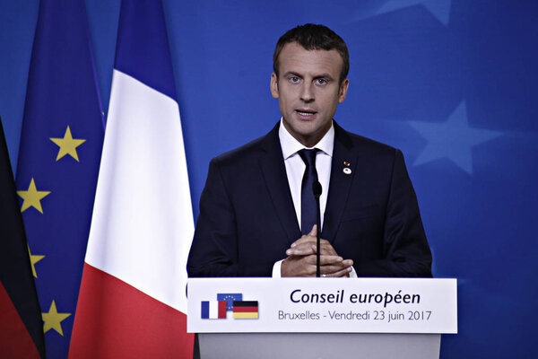 German Chancellor Angela Merkel, left, and French President Emmanuel Macron address the media at an EU summit in Brussels,Belgium on June 23, 2017. 