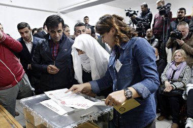 People wait to cast their vote during general elections at a polling station in Istanbul, Turkey on Nov. 1, 2015