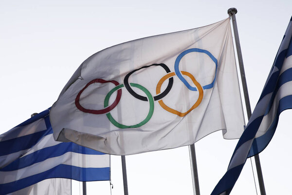 Flags of Greece and flags of Olympic games wave outside of Panathenaic Stadium in Athens, Greece on Aug. 21, 2018.