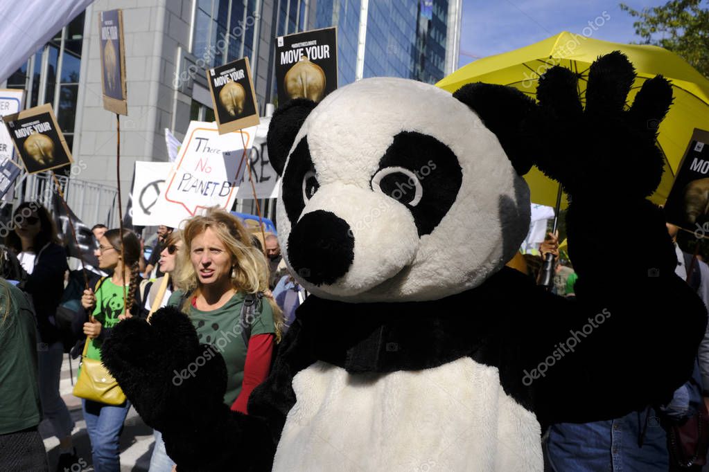 Brussels, Belgium. 20th September 2019.  Environmental activists take part in the Climate strike protest calling for action on climate change.