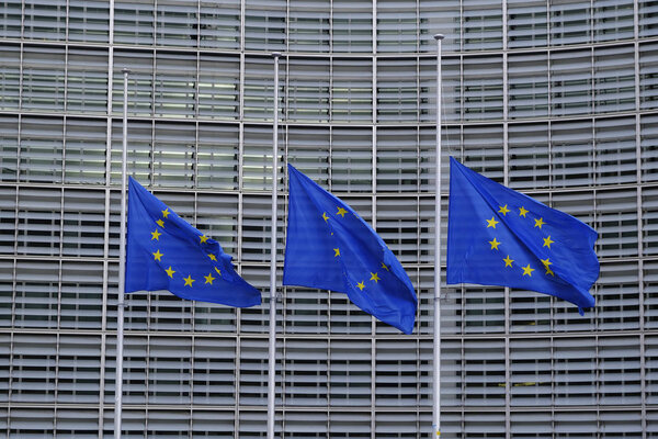 The European Union flags fly at half-mast as a tribute to former