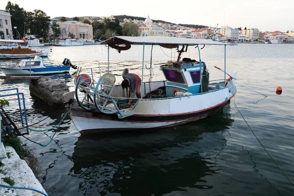 LESBOS ISLAND, GREECE - March 8, 2020. A Fisherman prpeares nets in port. Greek islands are famous for traditional boats used to catch fish — Stock Image Lesbos Island Greece March 2020 Fisherman Prpeares Nets Port Greek Stock Photo