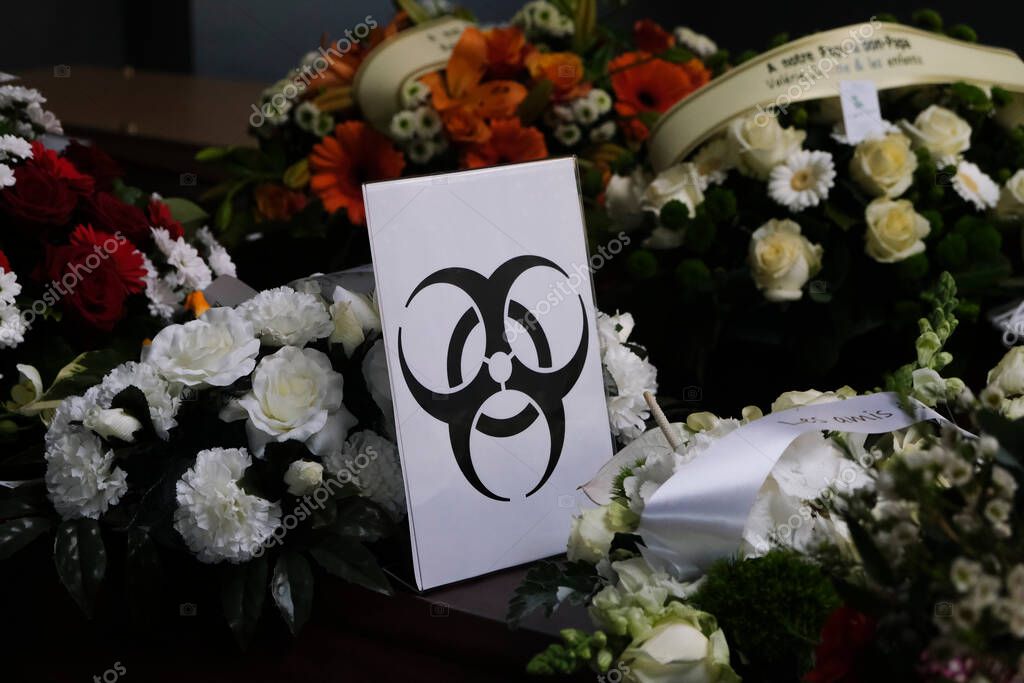 Coffins of COVID-19 victims are marked with a 'Biohazard' warning sign as they are placed next to each other at the Pompes Funebres Fontaine funeral service company in Gilly, Belgium, 09 April 2020.