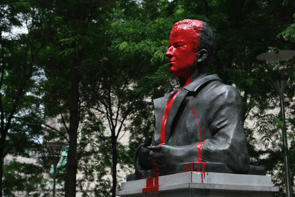 A picture taken on June 12, 2020 shows the vandalised statue of King Baudouin of Belgium (1930 - 1993) in front of Saint Michael and Gudula Cathedral, in the center of Brussels.