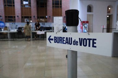 Election officials in  a polling station during the second round of the French Municipal elections in Lille, France on June, 28th 2020 clipart