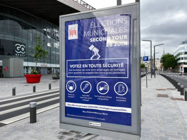 Election poster outside of polling station during the second round of the French Municipal elections in Lille, France on June, 28th 2020 clipart